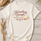Christian Baking T-Shirt — "Kneading Dough and Needing Jesus"